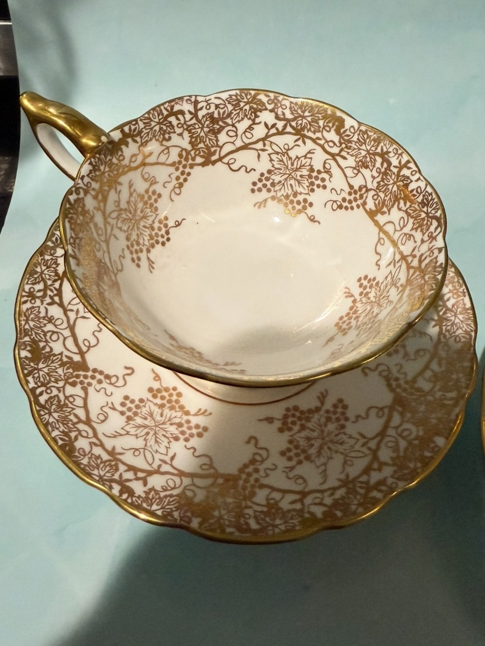 1 Gold Filigree Porcelain Teacup and Saucer - White and Gold